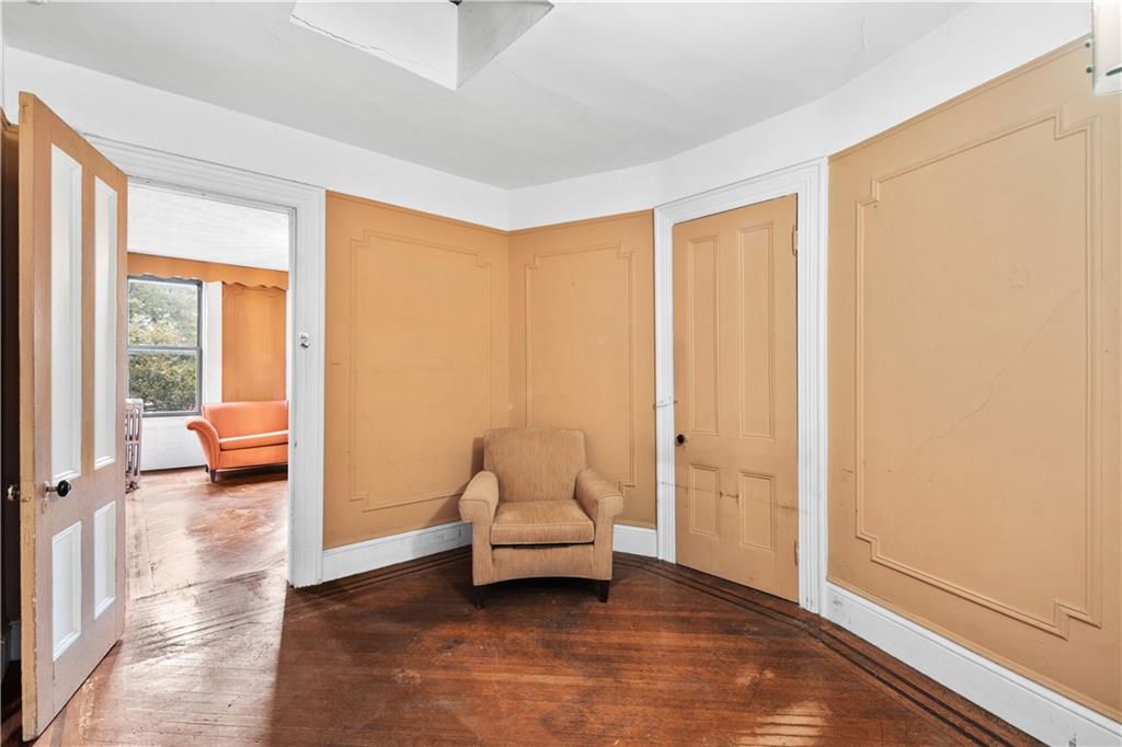 484 Decatur Street Brooklyn, NY 11233 - Photo 17 of 23 a living room with furniture and a large window