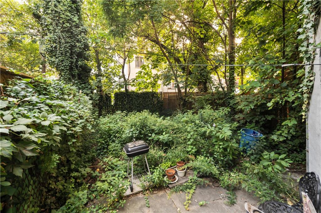 484 Decatur Street Brooklyn, NY 11233 - Photo 21 of 23 a view of a chair and table on the garden