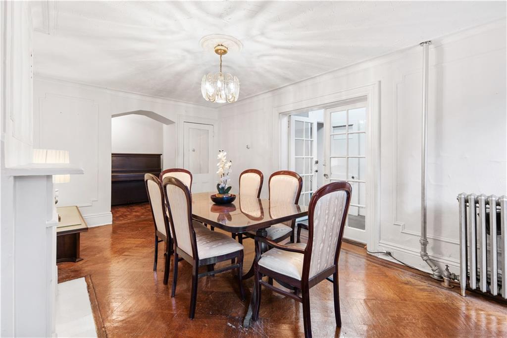 484 Decatur Street Brooklyn, NY 11233 - Photo 4 of 23 a view of a dining room with furniture and chandelier