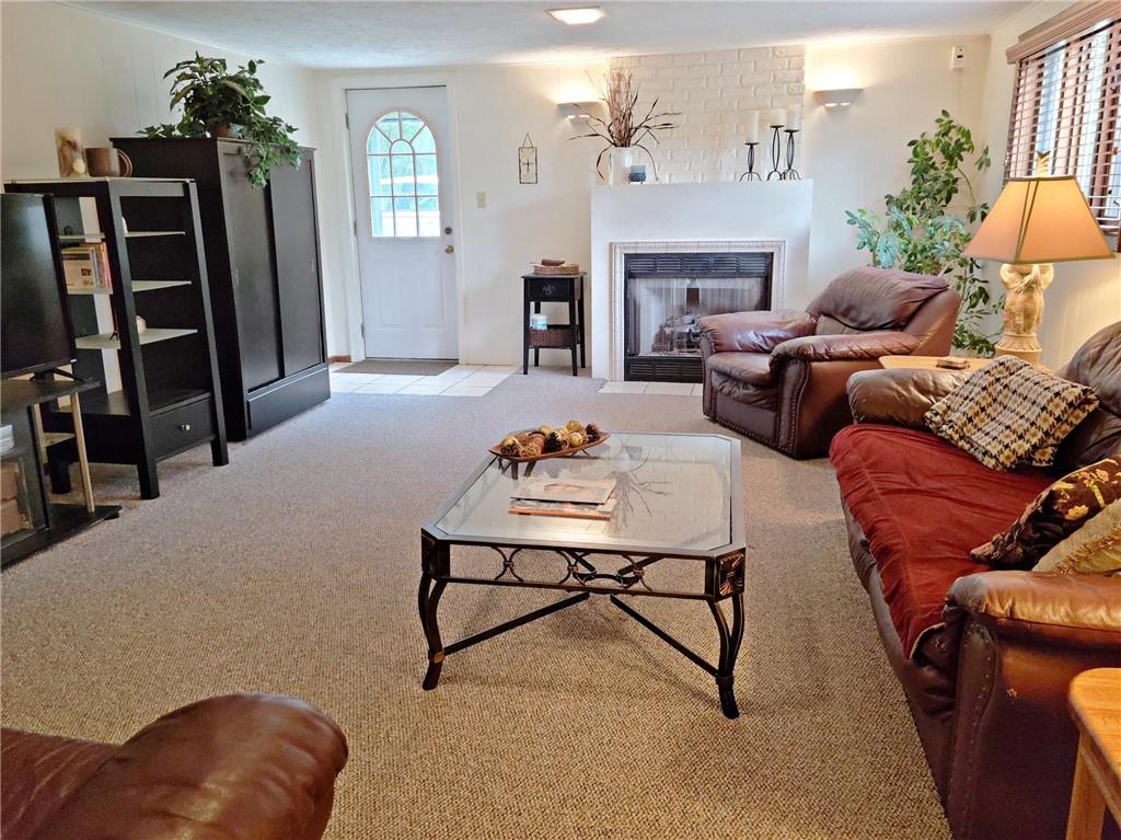 5184 Richland Road Gibsonia, PA 15044 - Photo 15 of 23 a living room with furniture and a fireplace