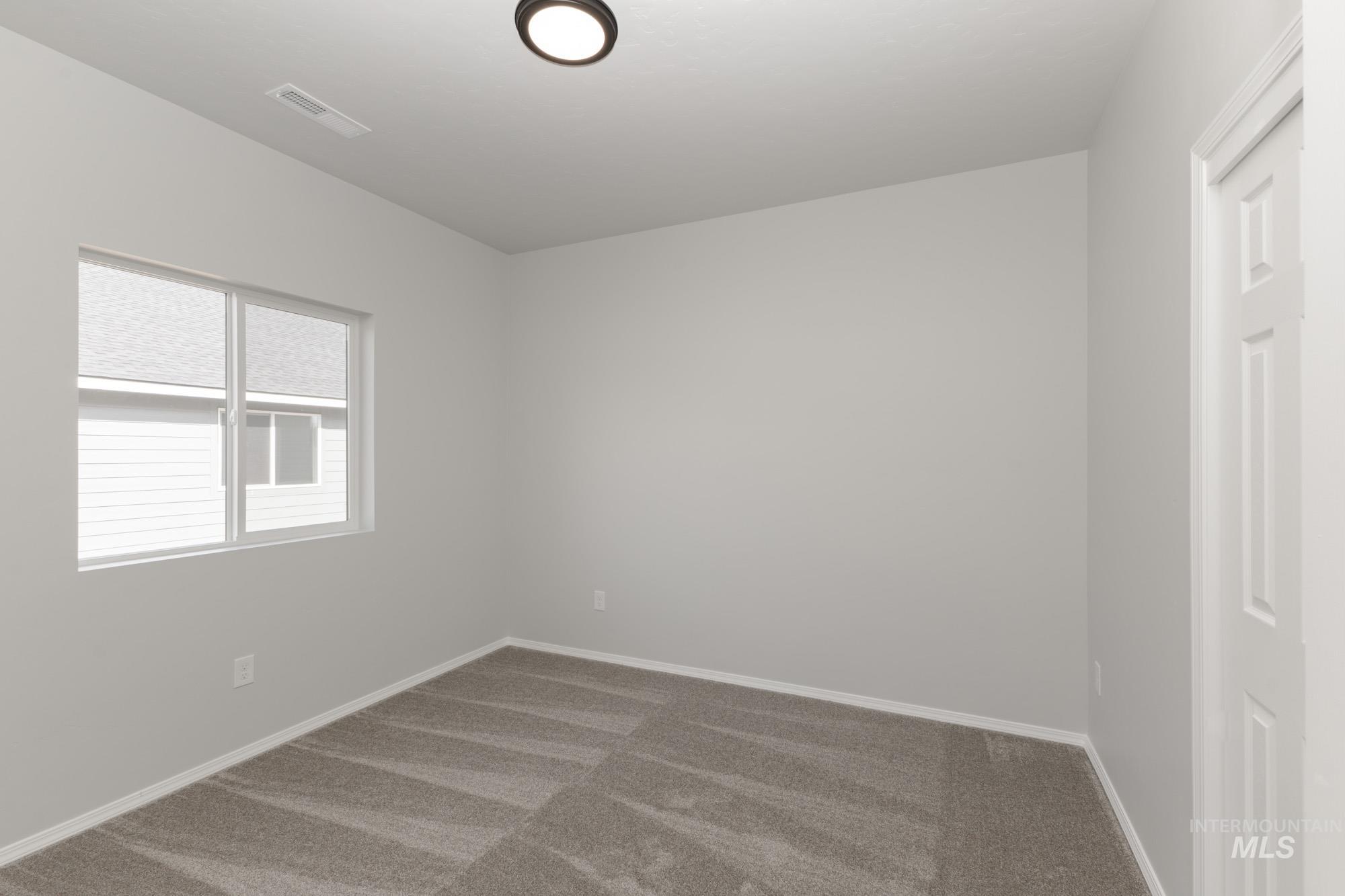 1459 Long Pond Street Middleton, ID 83644 - Photo 12 of 20 Spare room featuring carpet floors and baseboards