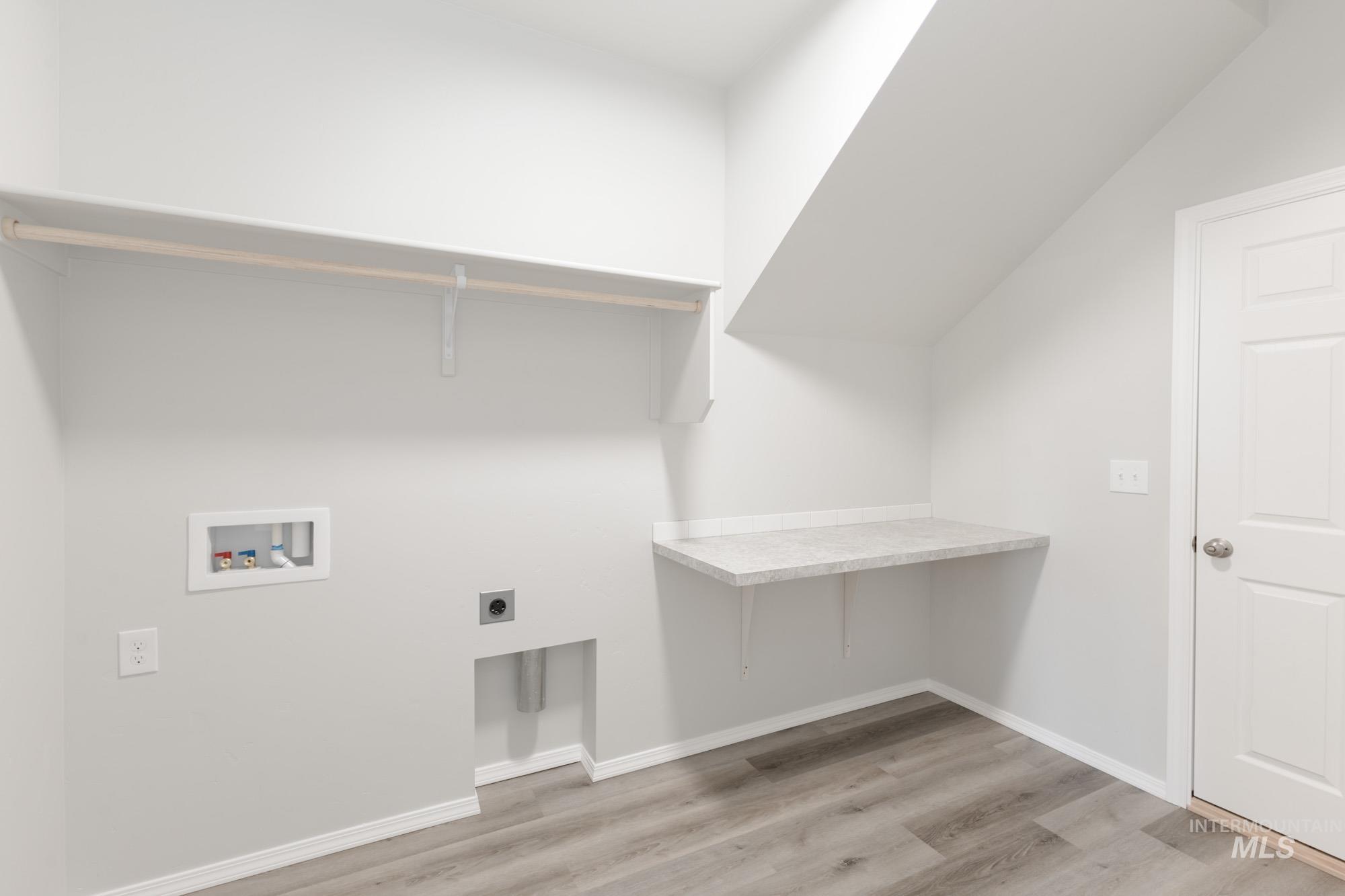 1459 Long Pond Street Middleton, ID 83644 - Photo 14 of 20 Laundry room featuring light wood-style floors, hookup for an electric dryer, and washer hookup