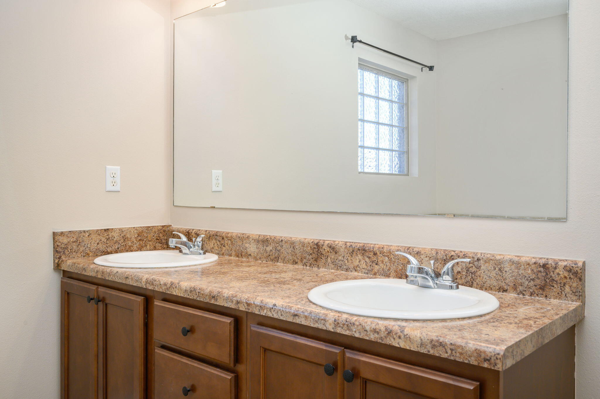 4521 Hermosa Road Crestview, FL 32539 - Photo 18 of 33 a bathroom with a granite countertop sink and a mirror