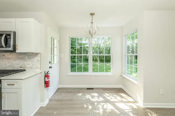 a view of a kitchen with a sink and dishwasher