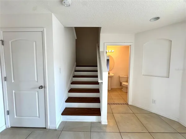 a view of entryway and hall with a door