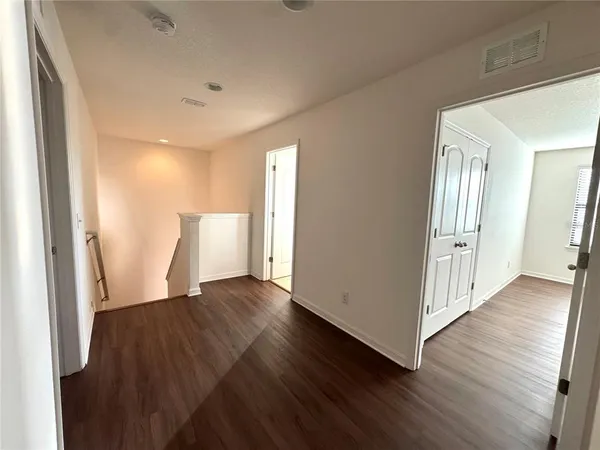 a view of a livingroom with wooden floor