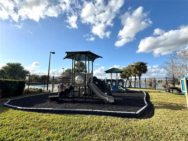 a view of a water fountain in front of the house