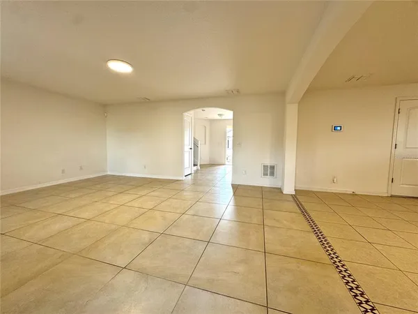 a view of an empty room and window