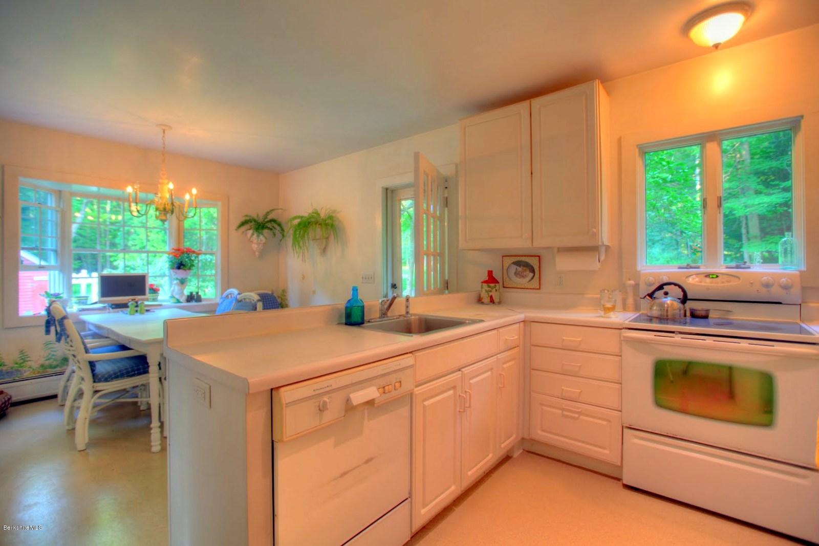 585 Main Road Monterey, MA 01245 - Photo 11 of 27 a kitchen that has a sink and a stove in it