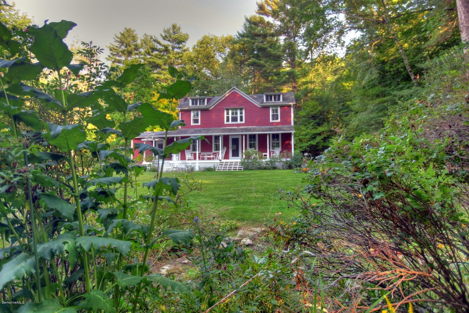 585 Main Road Monterey, MA 01245 - Photo 3 of 27 a view of a house with a yard and a tree