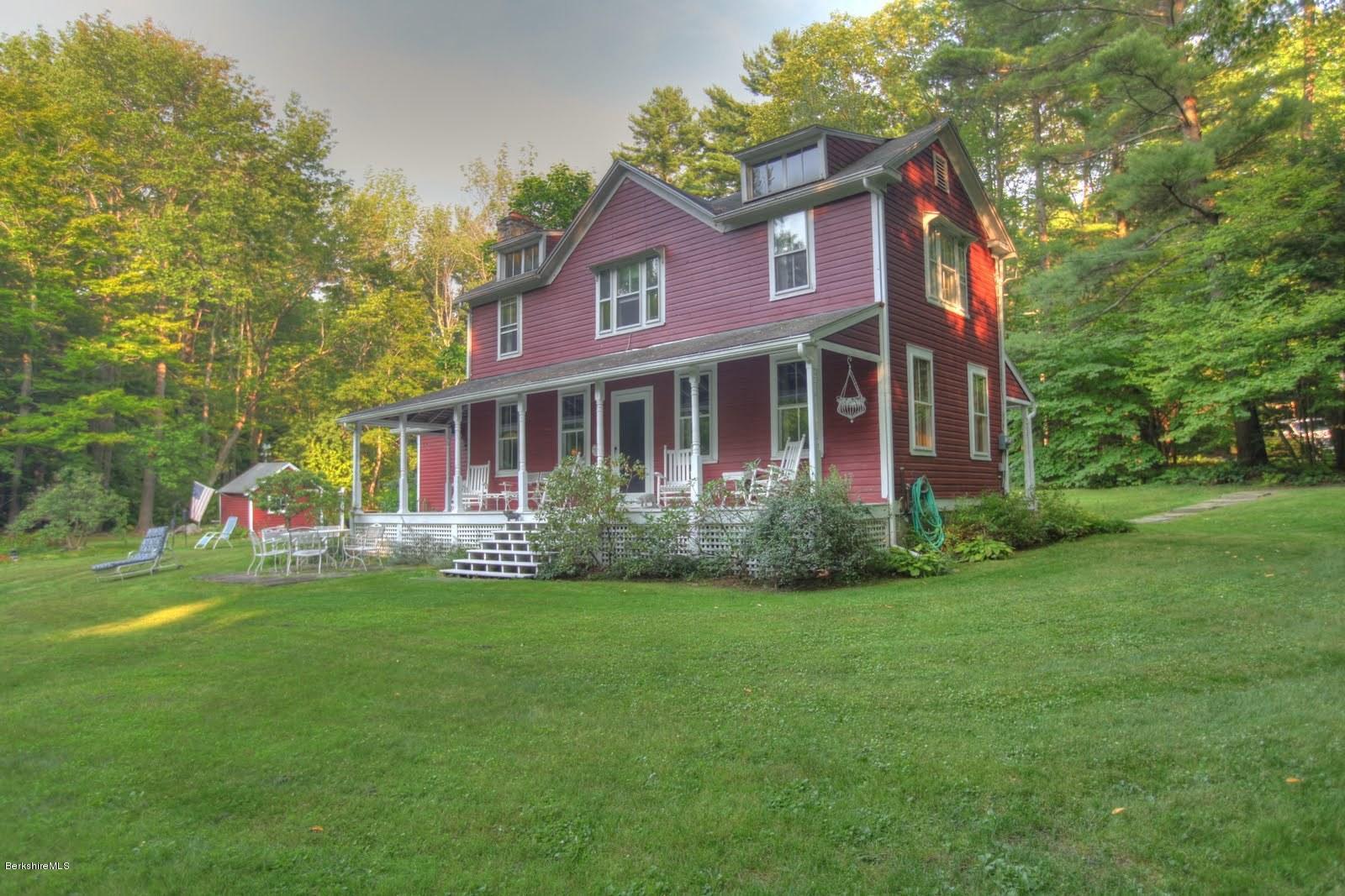 585 Main Road Monterey, MA 01245 - Photo 23 of 27 a view of a house with a big yard and large trees