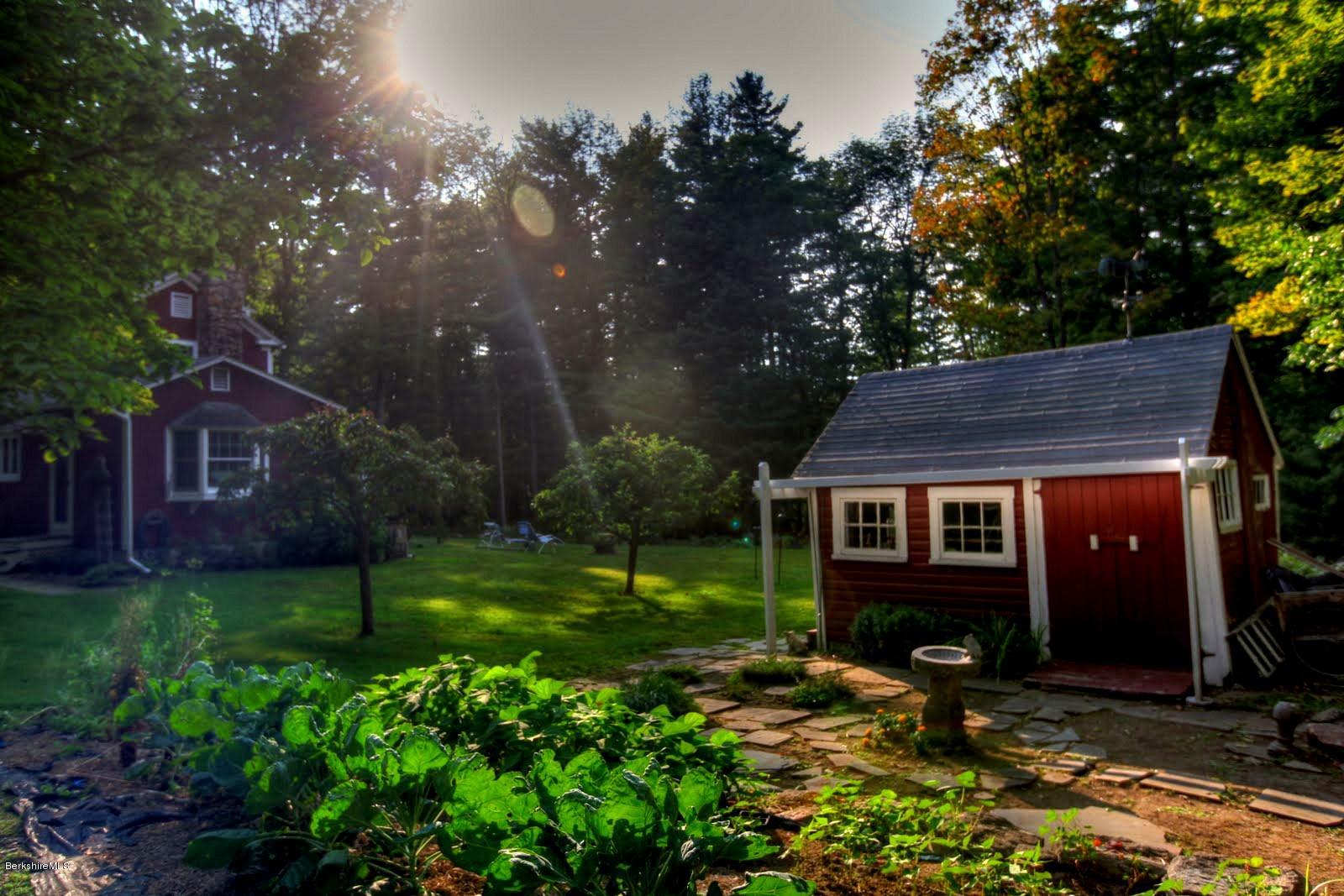 585 Main Road Monterey, MA 01245 - Photo 24 of 27 a view of a house with a yard