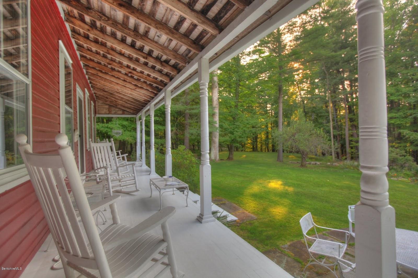 585 Main Road Monterey, MA 01245 - Photo 5 of 27 a view of porch with a table chairs and a backyard