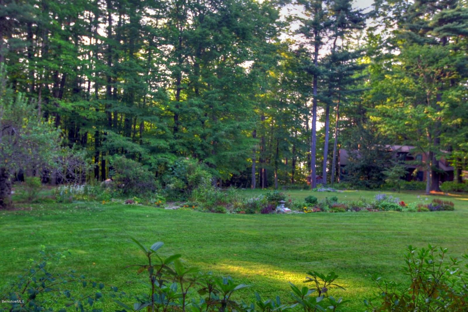 585 Main Road Monterey, MA 01245 - Photo 7 of 27 a view of a garden with large trees