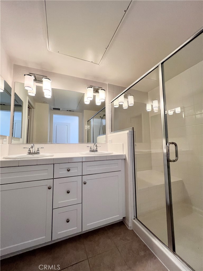 58 South 5th Street, Unit F Alhambra, CA 91801 - Photo 16 of 24 a bathroom with a double vanity sink mirror and shower