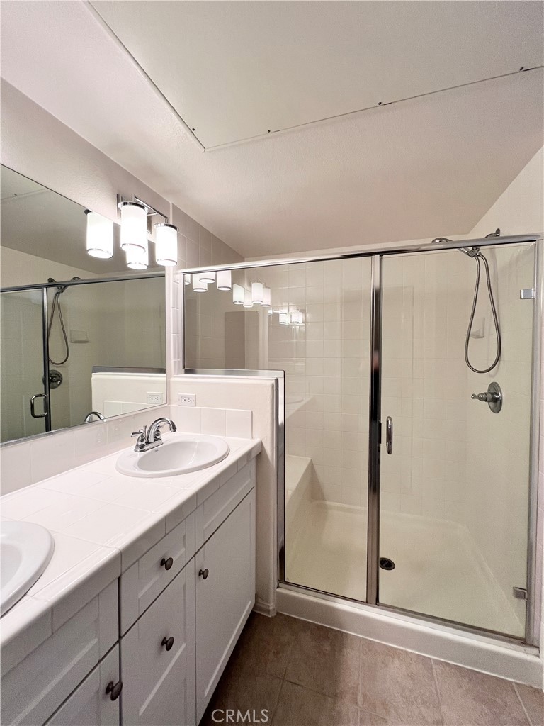 58 South 5th Street, Unit F Alhambra, CA 91801 - Photo 17 of 24 a bathroom with a double vanity sink mirror and shower