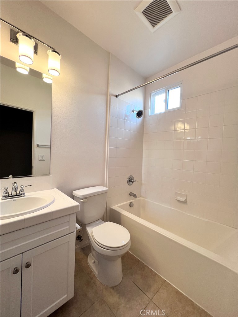58 South 5th Street, Unit F Alhambra, CA 91801 - Photo 20 of 24 a bathroom with a sink a toilet and shower