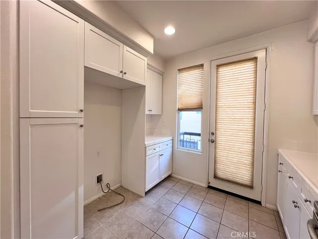a view of a kitchen with refrigerator and dishwasher