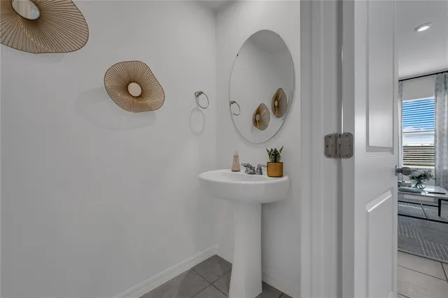 a view of a two chairs in the patio with a yard