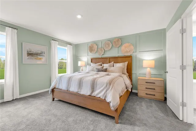 a spacious bedroom with a bed and a painting on the wall