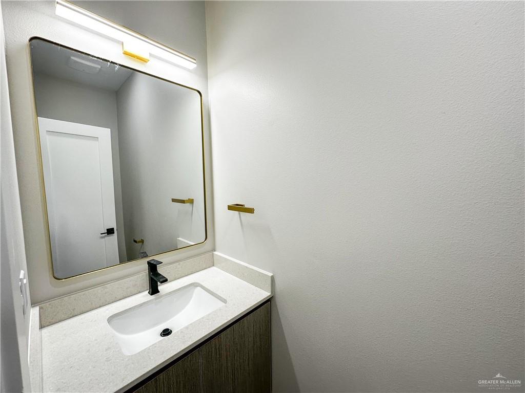 3429 May Street Mission, TX 78573 - Photo 13 of 16 a bathroom with a sink and a mirror