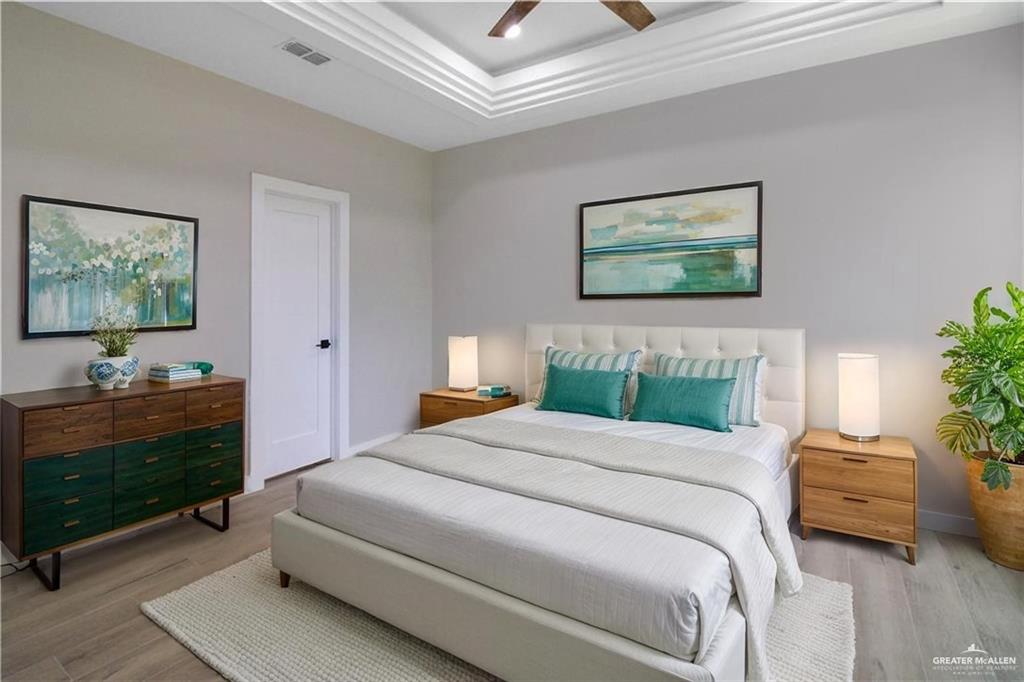 3429 May Street Mission, TX 78573 - Photo 5 of 16 a bedroom with a bed and a workspace