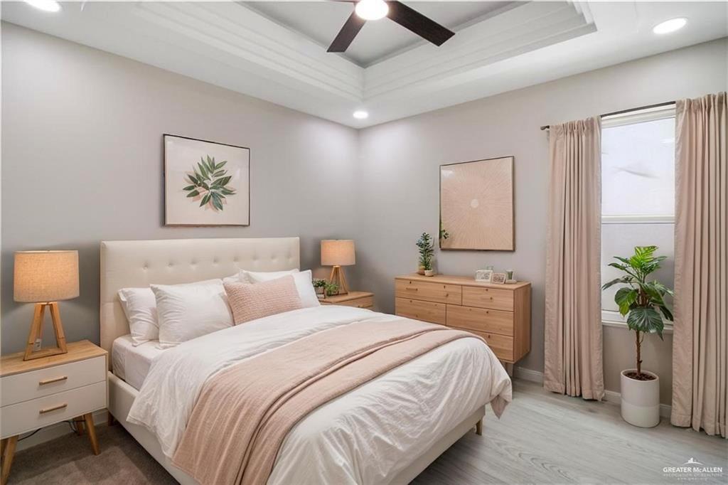 3429 May Street Mission, TX 78573 - Photo 7 of 16 a bedroom with a balcony a bed and a potted plant