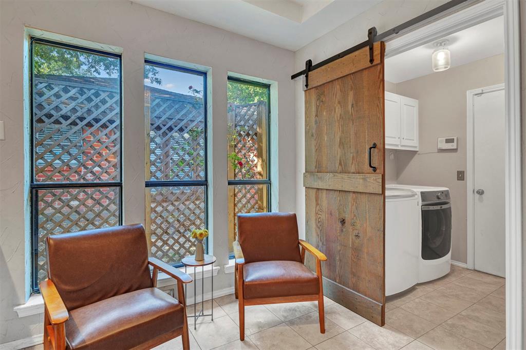 2317 Daybreak Trail Plano, TX 75093 - Photo 14 of 29 a living room with furniture a front door and a window