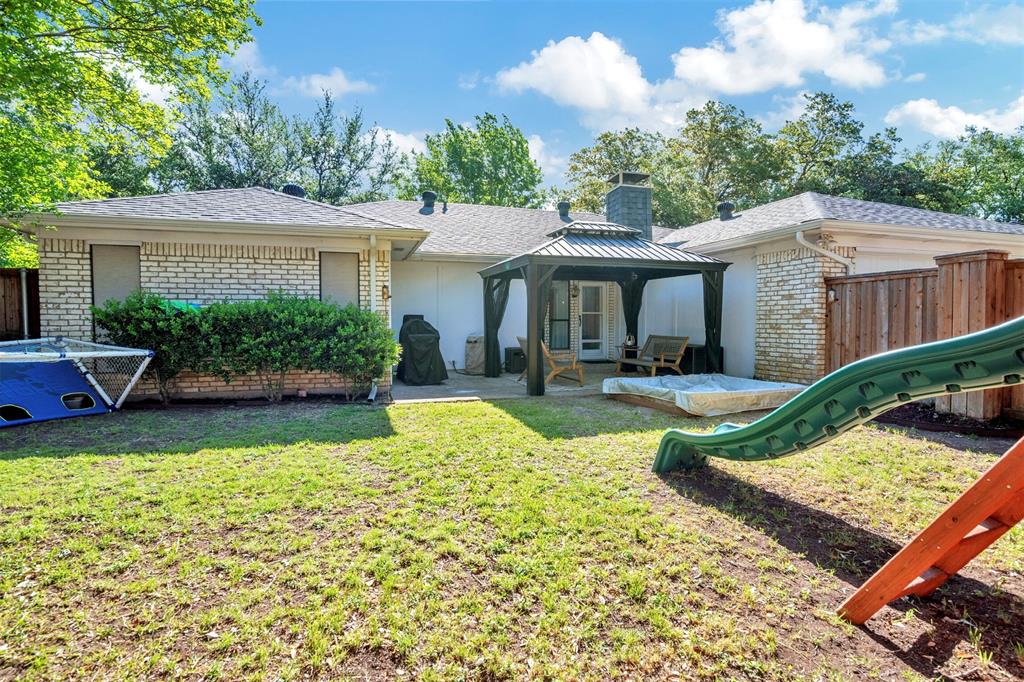 2317 Daybreak Trail Plano, TX 75093 - Photo 23 of 29 a front view of a house with garden