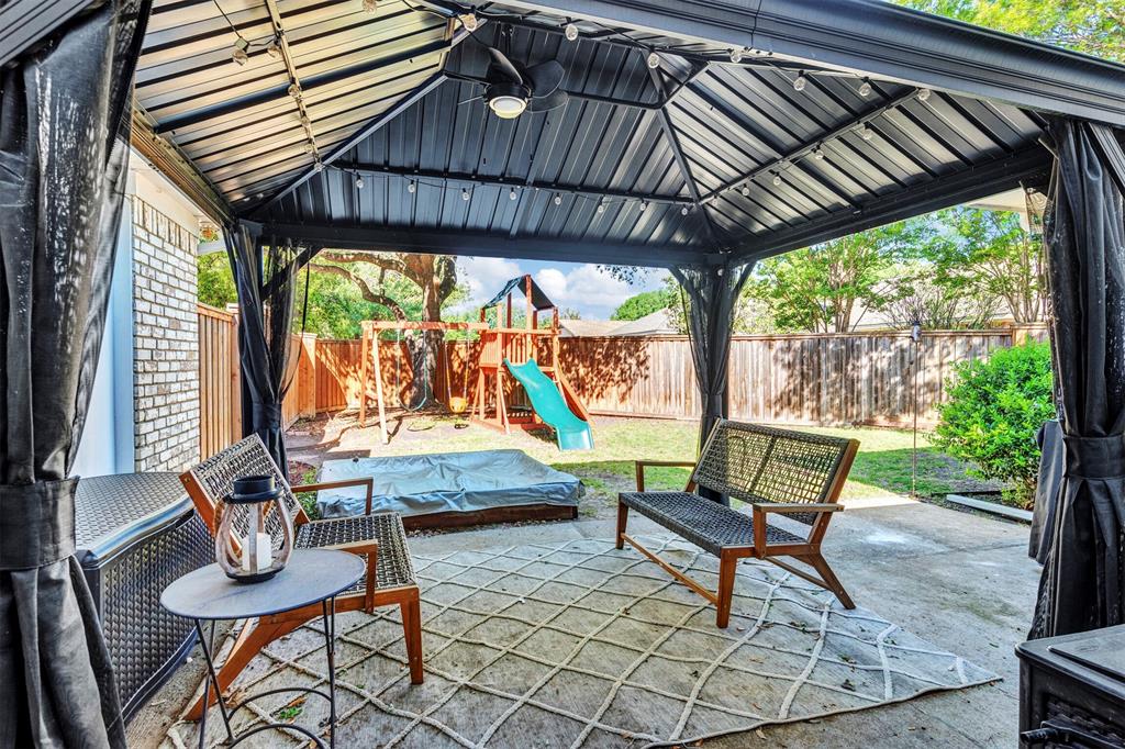 2317 Daybreak Trail Plano, TX 75093 - Photo 26 of 29 a outdoor living space with furniture and garden view