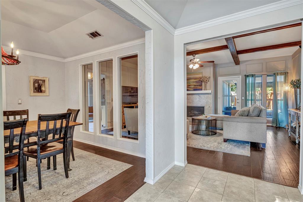 2317 Daybreak Trail Plano, TX 75093 - Photo 3 of 29 a view of dining room and livingroom with furniture wooden floor and a rug