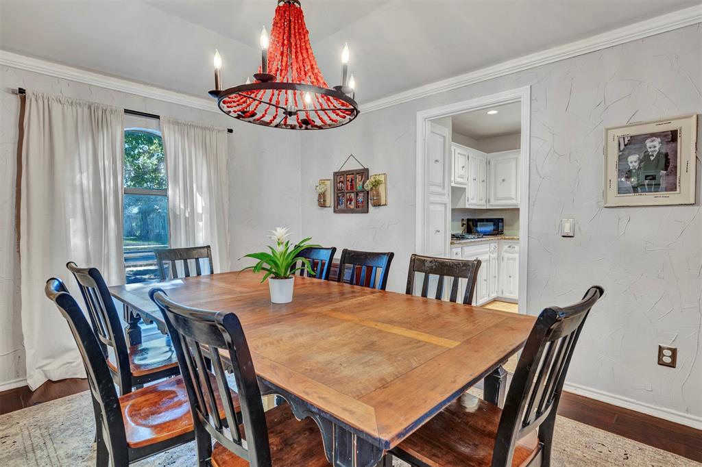 2317 Daybreak Trail Plano, TX 75093 - Photo 4 of 29 a view of a dining room with furniture window and wooden floor