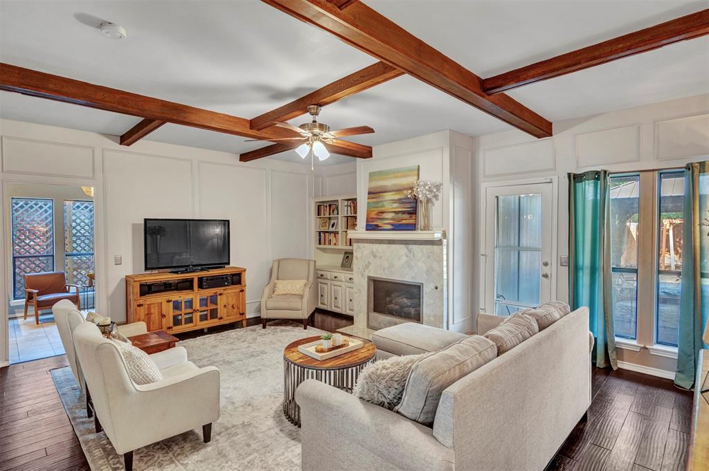 2317 Daybreak Trail Plano, TX 75093 - Photo 7 of 29 a living room with furniture and a fireplace