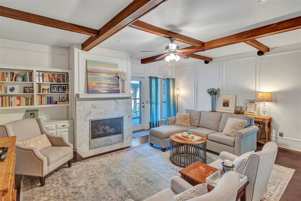 2317 Daybreak Trail Plano, TX 75093 - Photo 8 of 29 a living room with furniture and a fireplace