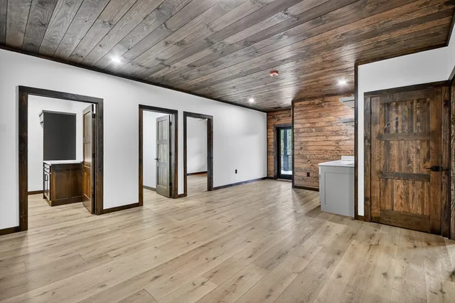 a view of a livingroom with wooden floor