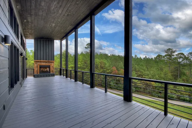 a view of a balcony with wooden floor