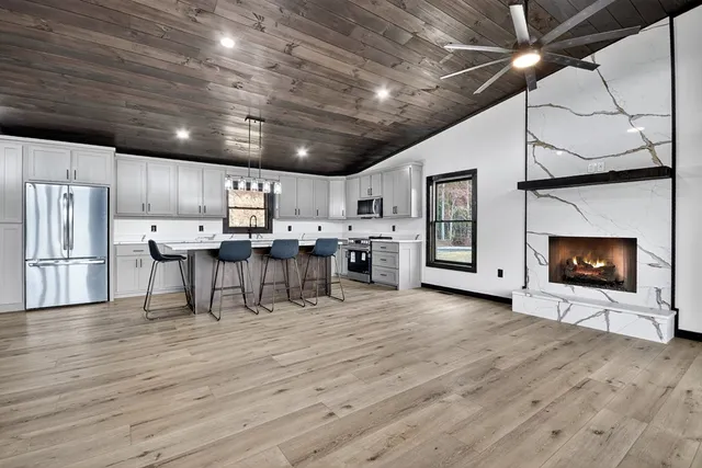 a view of a kitchen with furniture and a fireplace
