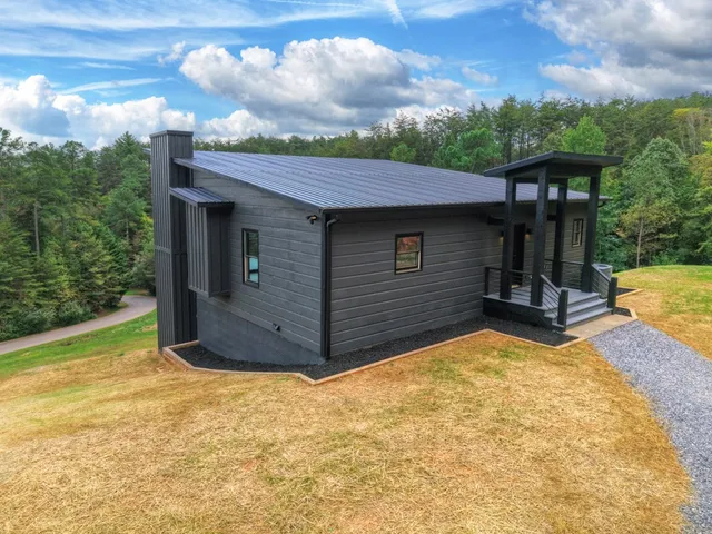 a view of backyard with a garden and deck