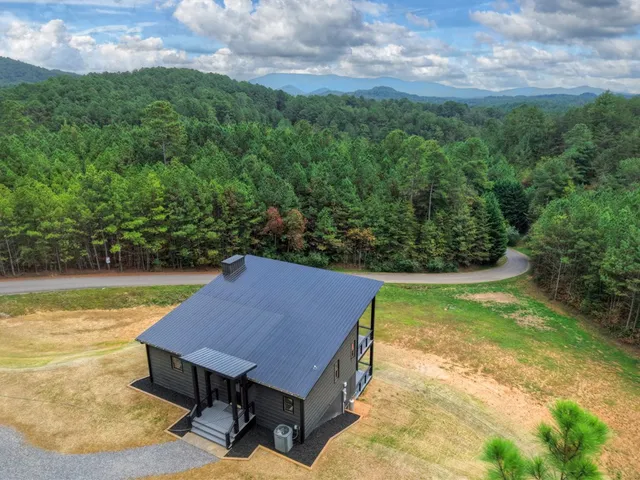 an aerial view of a house having yard