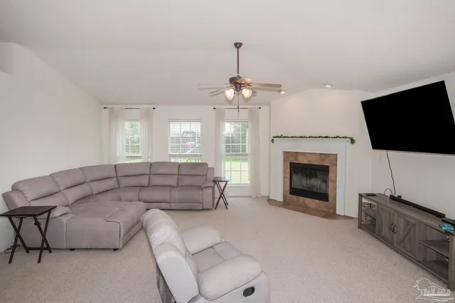 a bathroom with a shower a sink and a window