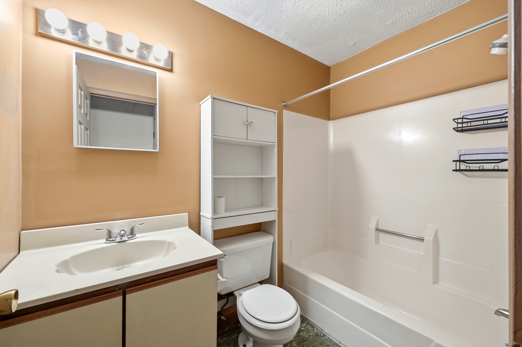 19-21 Wedgewood Circle Springfield, MA 01129 - Photo 25 of 32 a bathroom with a sink toilet and shower