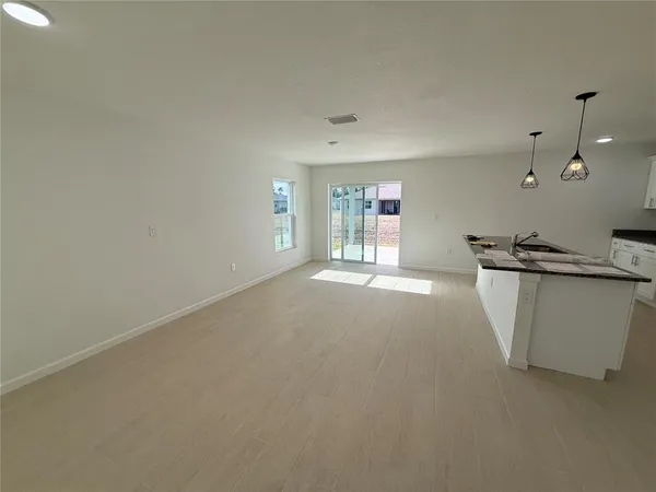 a view of a kitchen with a sink