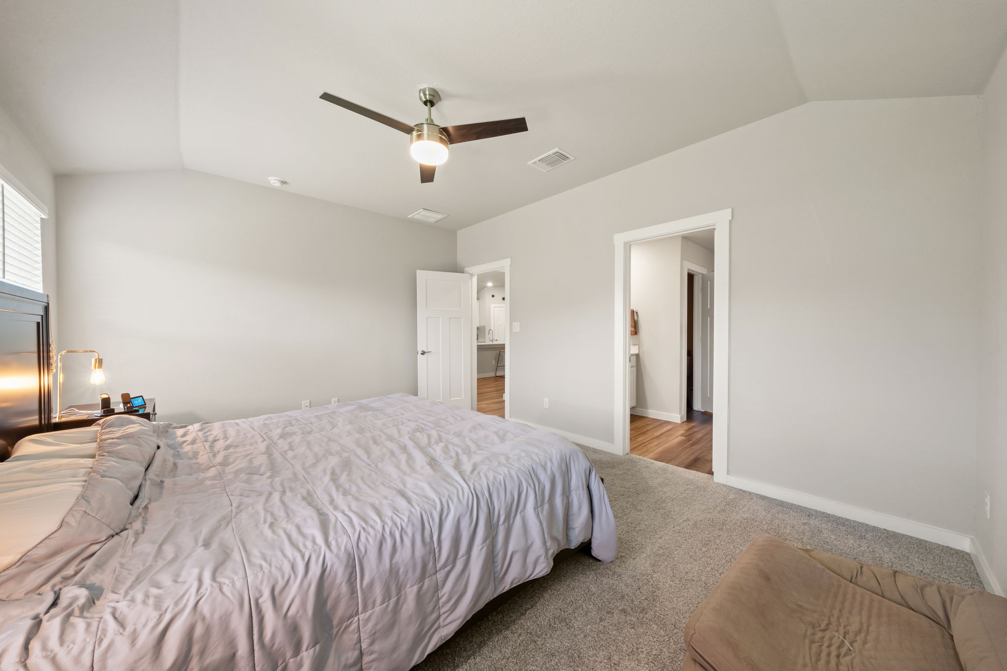 1117 Tipton Street Georgetown, TX 78633 - Photo 20 of 40 Vaulted ceiling with a contemporary ceiling fan, light gray wall paint, and gray carpeting