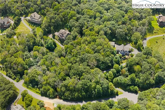 a view of a garden with a building