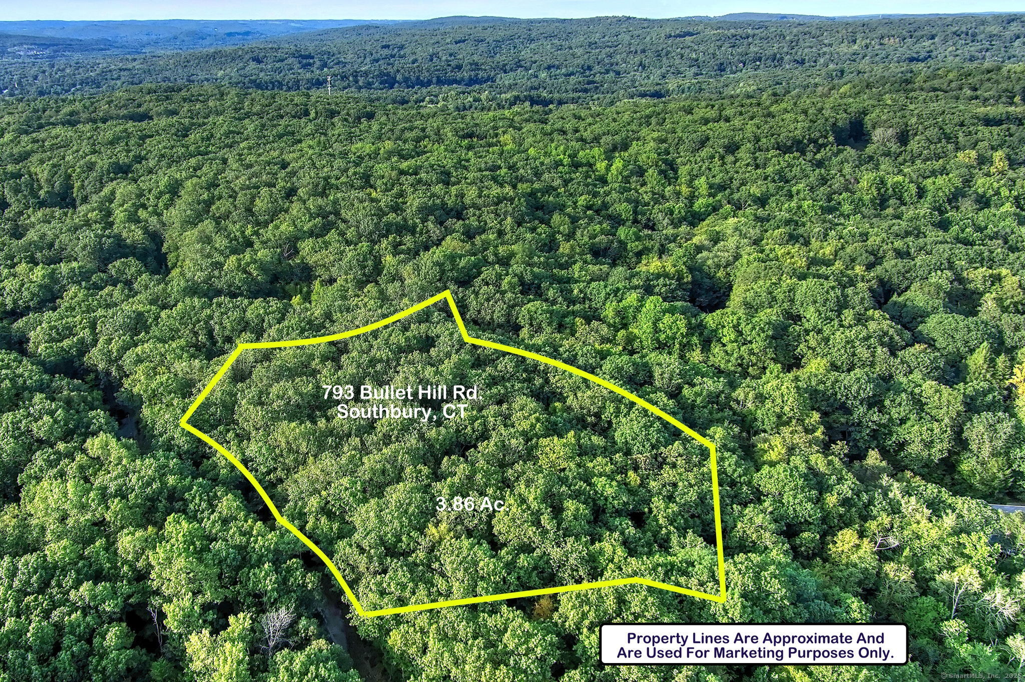 793 Bullet Hill Road Southbury, CT 06488 - Photo 2 of 3 an aerial view of a house with a yard