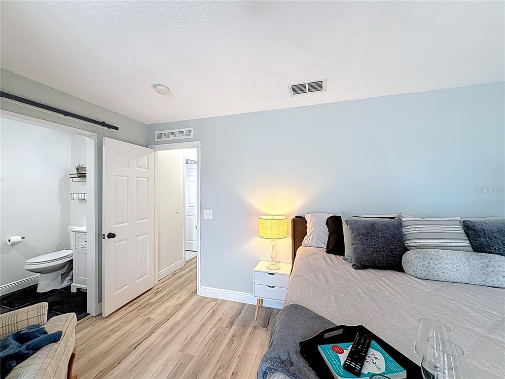 14908 Southwest 46th Circle Ocala, FL 34473 - Photo 16 of 46 a bedroom with a bed and a couch
