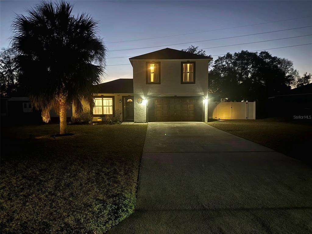 14908 Southwest 46th Circle Ocala, FL 34473 - Photo 3 of 46 a front view of a house with a yard