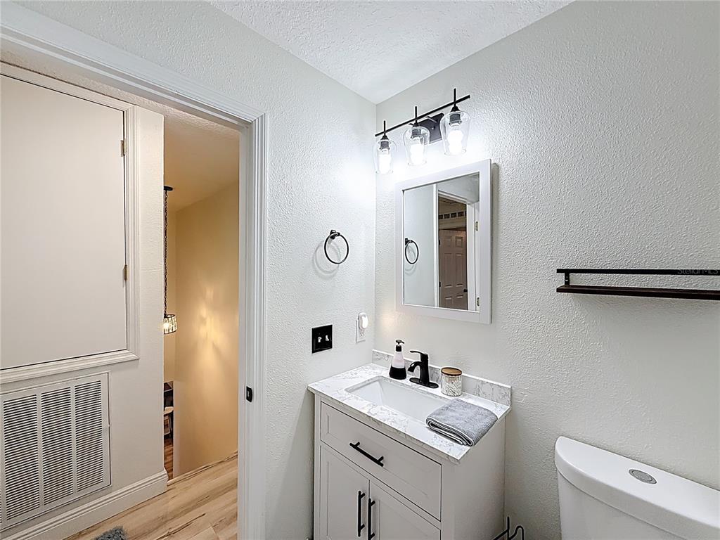14908 Southwest 46th Circle Ocala, FL 34473 - Photo 32 of 46 a bathroom with a sink toilet and shower