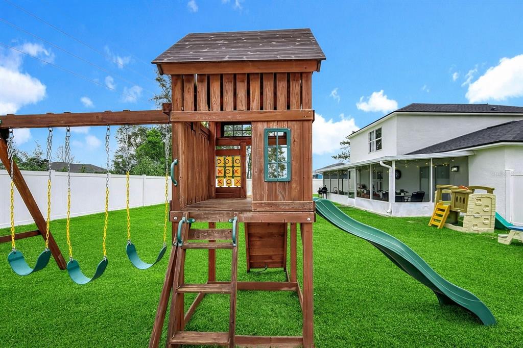 14908 Southwest 46th Circle Ocala, FL 34473 - Photo 45 of 46 a view of a house with a yard deck and a patio