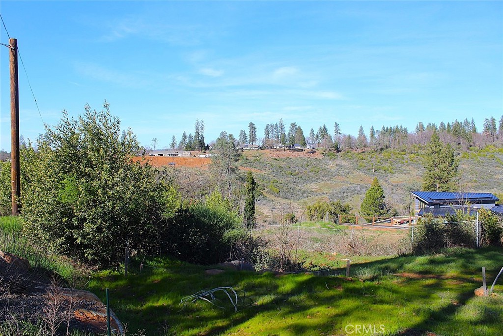 5709 Jewell Road Paradise, CA 95969 - Photo 2 of 8 a view of a house with a yard and outdoor seating
